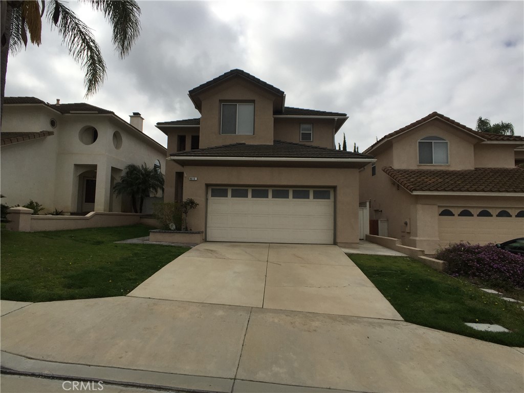 8616 Silver Ridge Lane Anaheim, CA 92808 - Photo 2 of 8 front view of a house with a garden