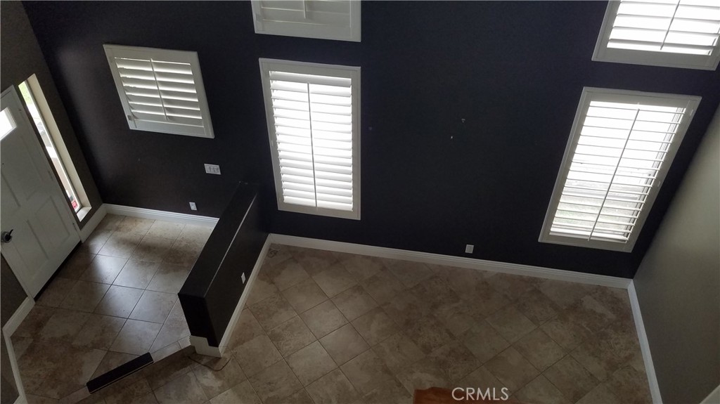 8616 Silver Ridge Lane Anaheim, CA 92808 - Photo 4 of 8 a view of an empty room with a window