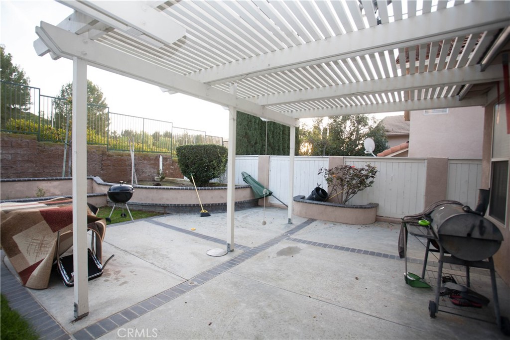 8616 Silver Ridge Lane Anaheim, CA 92808 - Photo 8 of 8 a view of a porch with furniture and a grill