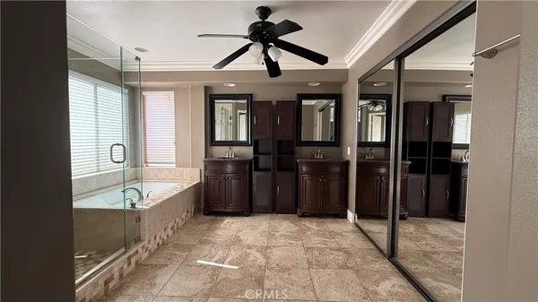 a bathroom with a tub and shower