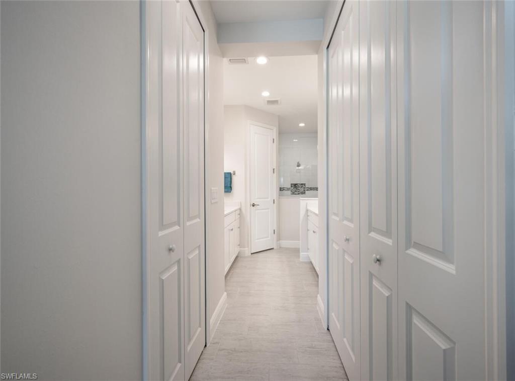 2247 Marquesa Circle Naples, FL 34112 - Photo 11 of 27 a view of a hallway with wooden floor