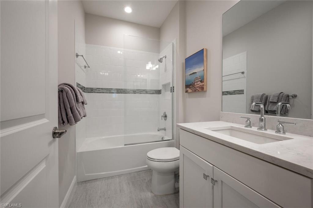 2247 Marquesa Circle Naples, FL 34112 - Photo 13 of 27 a bathroom with a sink a toilet and shower