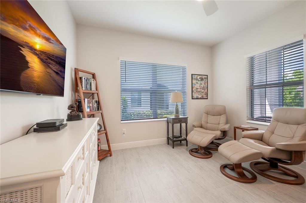 2247 Marquesa Circle Naples, FL 34112 - Photo 15 of 27 a living room with furniture and a flat screen tv