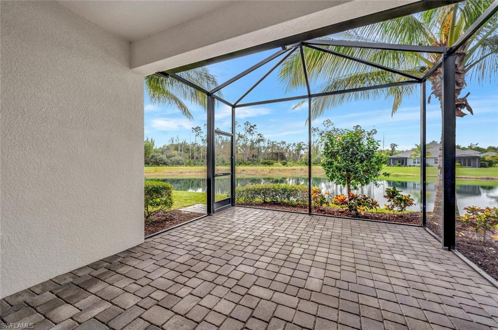 2247 Marquesa Circle Naples, FL 34112 - Photo 17 of 27 a view of a porch with a bench in front of it