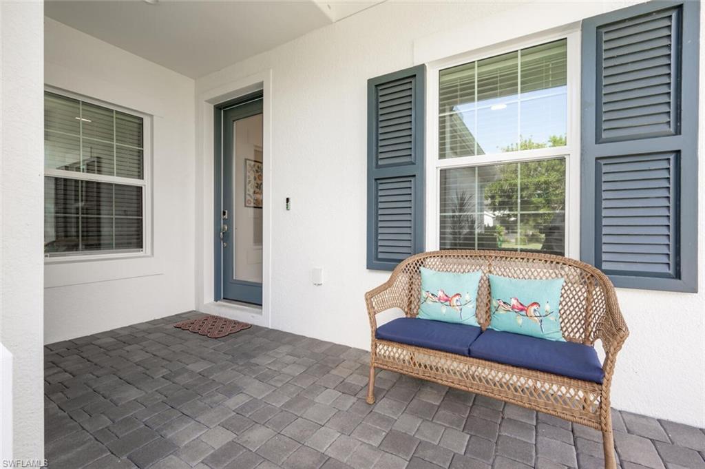 2247 Marquesa Circle Naples, FL 34112 - Photo 20 of 27 a bedroom with furniture and a window