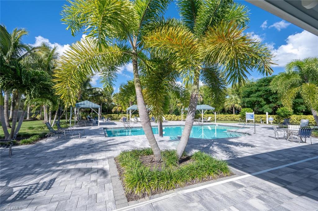 2247 Marquesa Circle Naples, FL 34112 - Photo 26 of 27 a view of a yard with palm trees