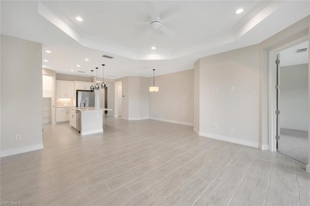 2247 Marquesa Circle Naples, FL 34112 - Photo 7 of 27 a view of empty room with wooden floor