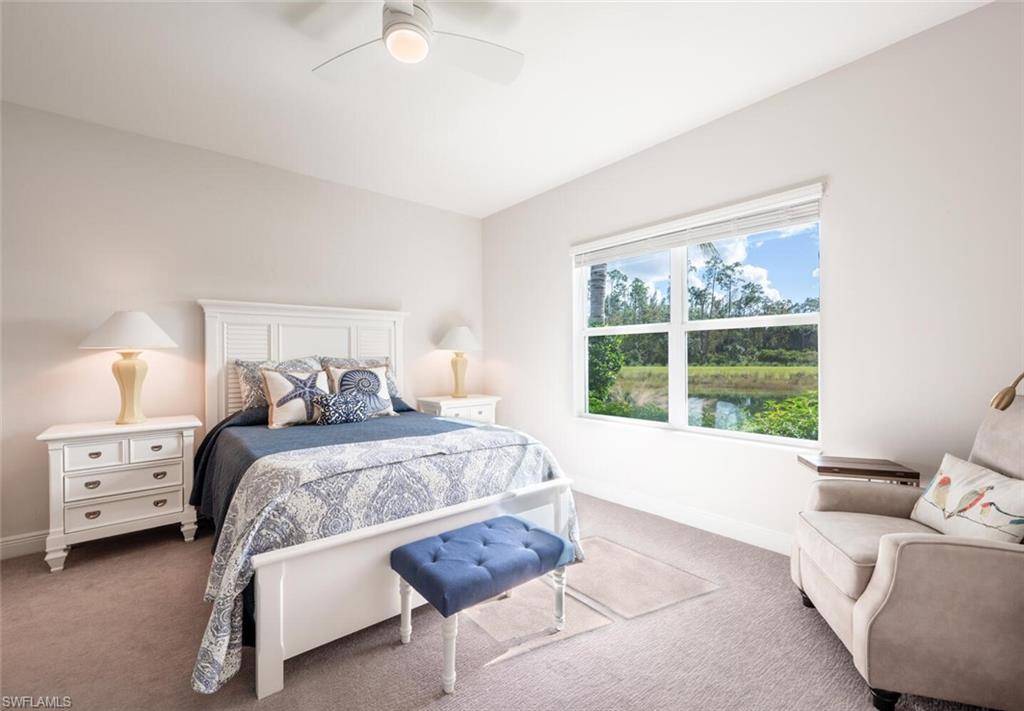 2247 Marquesa Circle Naples, FL 34112 - Photo 9 of 27 a bed room with a bed and a window