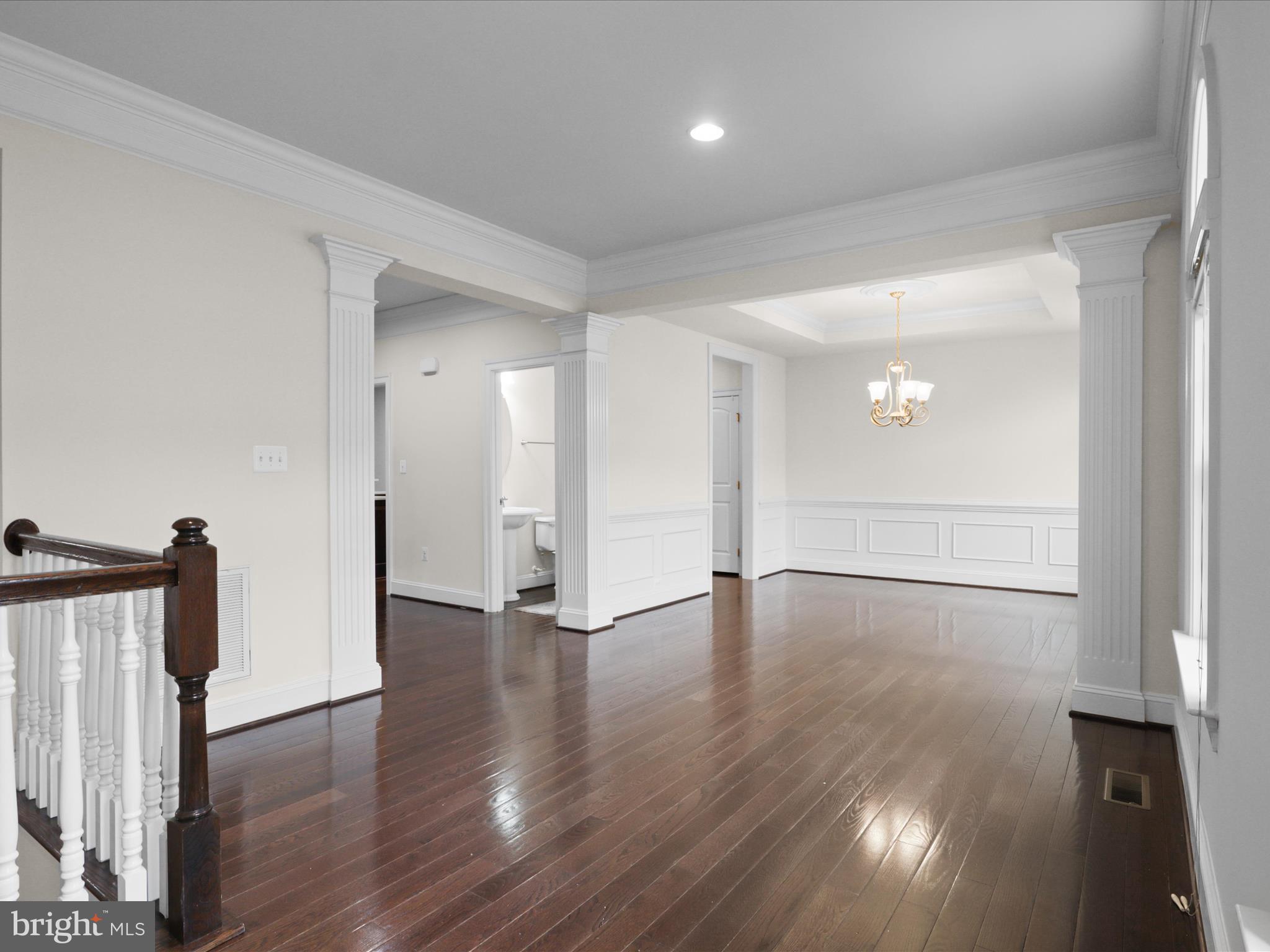 25138 Earlsdon Terrace Chantilly, VA 20152 - Photo 11 of 54 a view of an empty room with wooden floor and a window