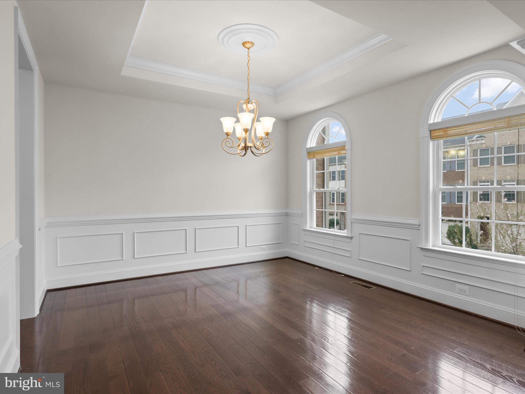 25138 Earlsdon Terrace Chantilly, VA 20152 - Photo 12 of 54 a view of an empty room with wooden floor and a window