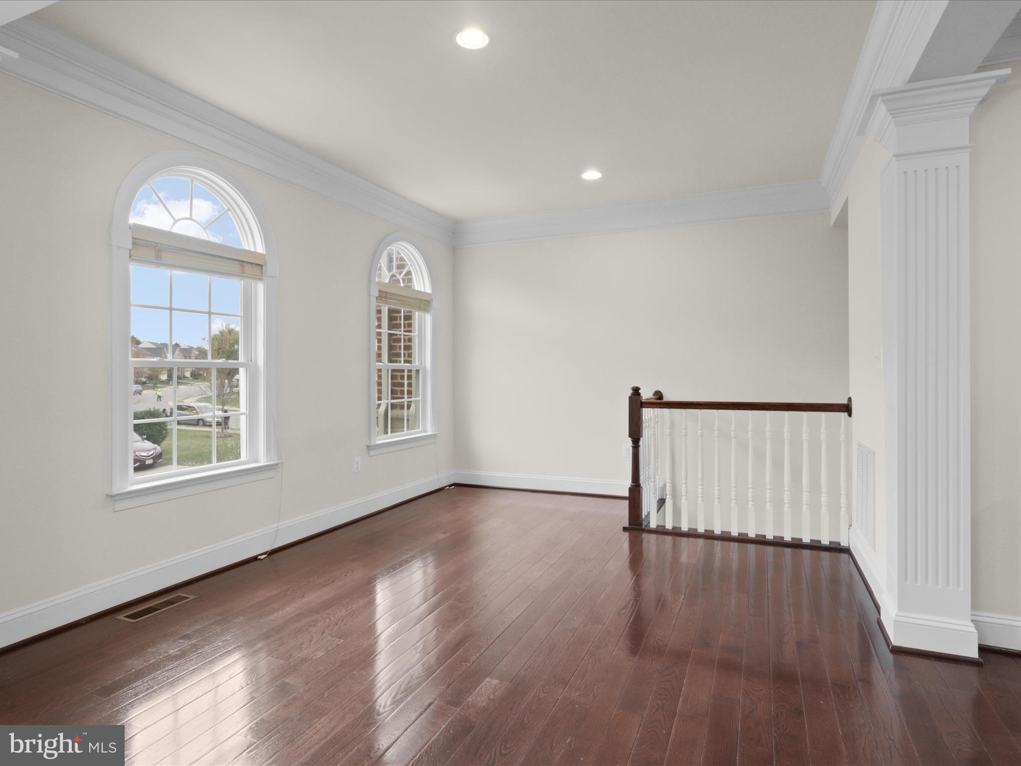 25138 Earlsdon Terrace Chantilly, VA 20152 - Photo 15 of 54 a view of an empty room with wooden floor and a window