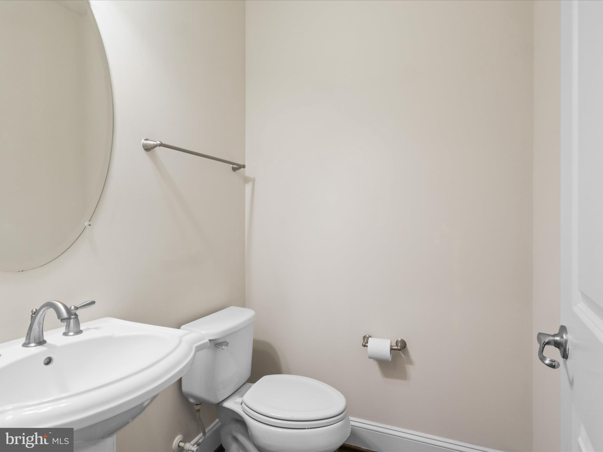25138 Earlsdon Terrace Chantilly, VA 20152 - Photo 17 of 54 a white toilet sitting next to a bathroom sink