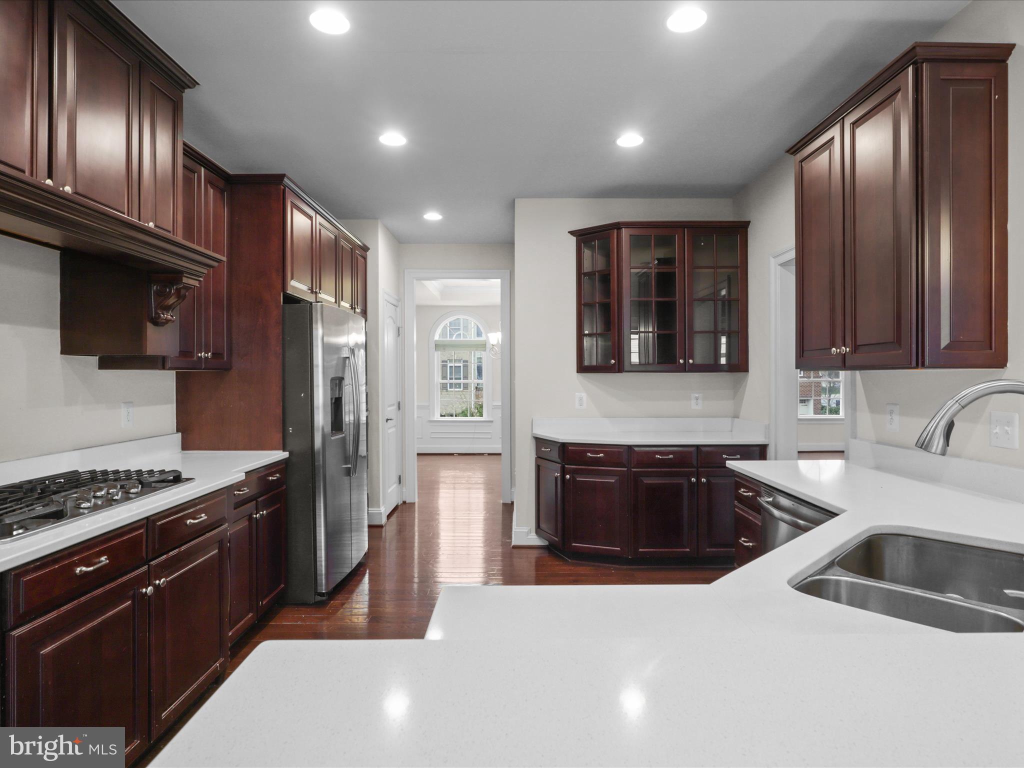 25138 Earlsdon Terrace Chantilly, VA 20152 - Photo 21 of 54 a kitchen with granite countertop a stove and a sink