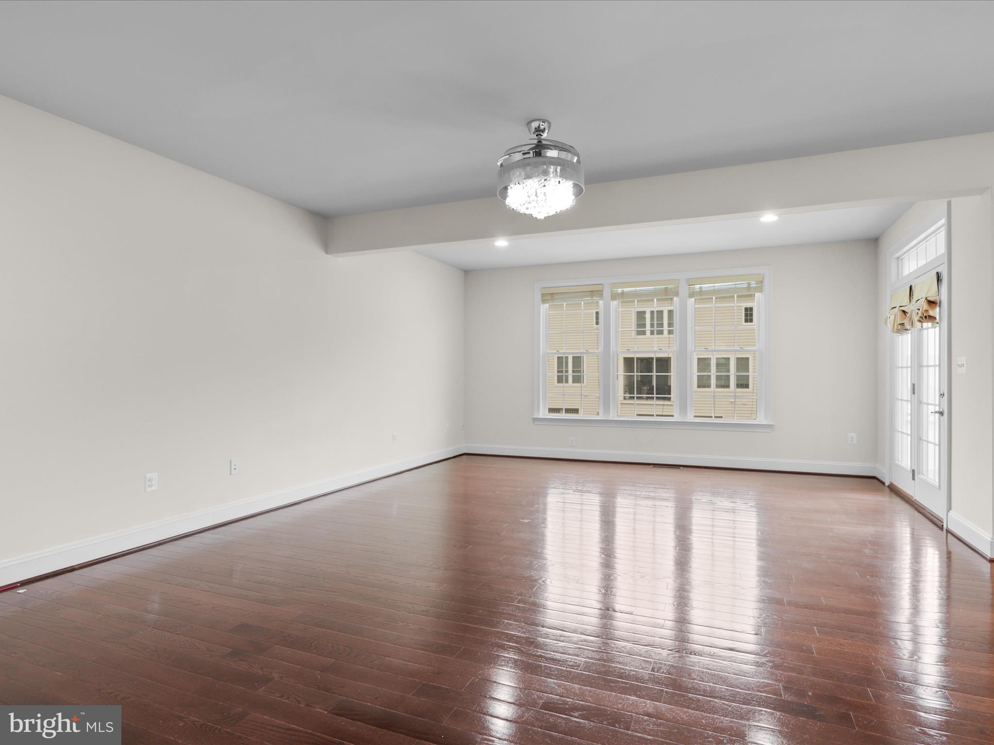 25138 Earlsdon Terrace Chantilly, VA 20152 - Photo 23 of 54 an empty room with wooden floor and windows