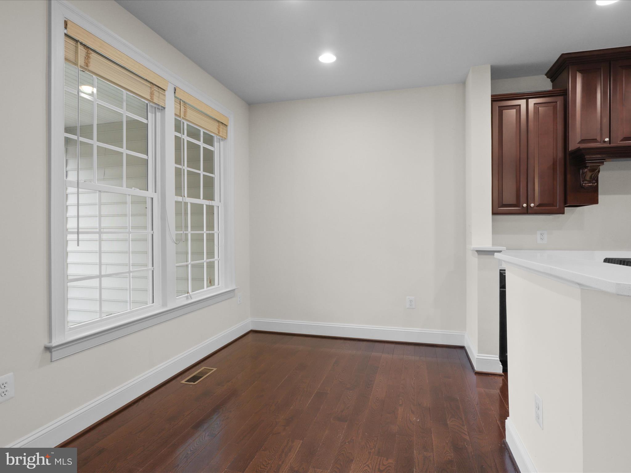25138 Earlsdon Terrace Chantilly, VA 20152 - Photo 26 of 54 an empty room with wooden floor and windows