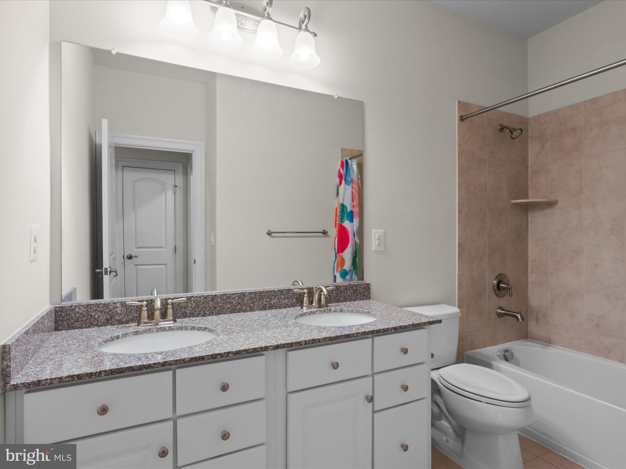 25138 Earlsdon Terrace Chantilly, VA 20152 - Photo 42 of 54 a bathroom with a granite countertop sink toilet and shower