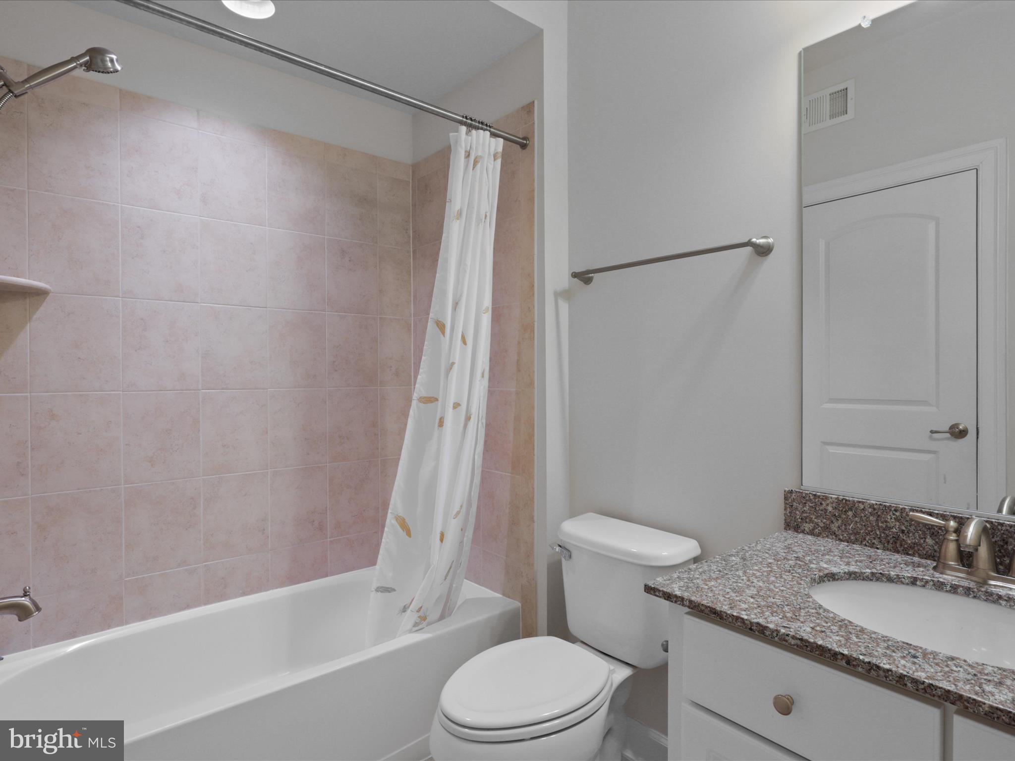 25138 Earlsdon Terrace Chantilly, VA 20152 - Photo 10 of 54 a bathroom with a granite countertop sink toilet and shower