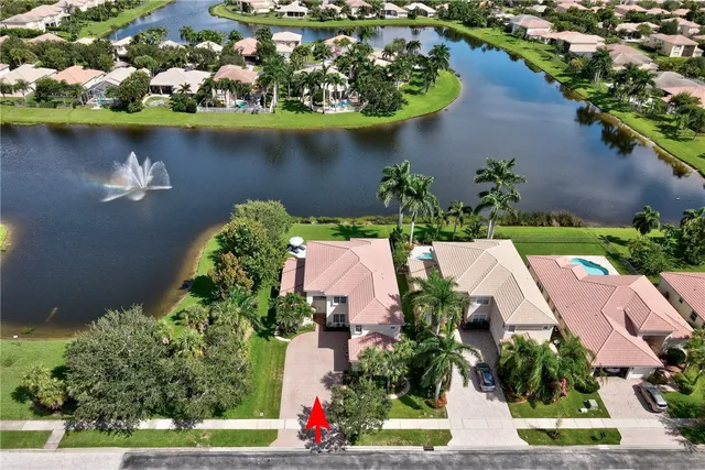 an aerial view of house with yard swimming pool and outdoor seating