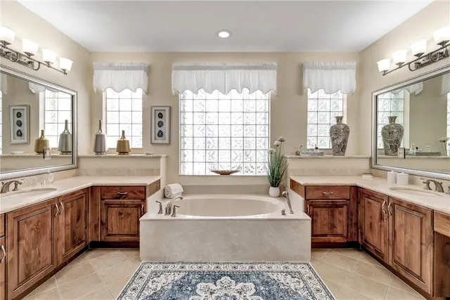 a large kitchen with a large window and a sink