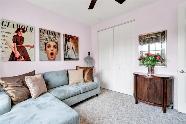 a living room with furniture flowerpot and window