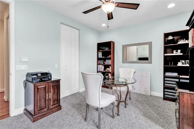 a bathroom with a granite countertop sink a toilet and shower