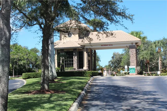 an aerial view of a house with a lake view