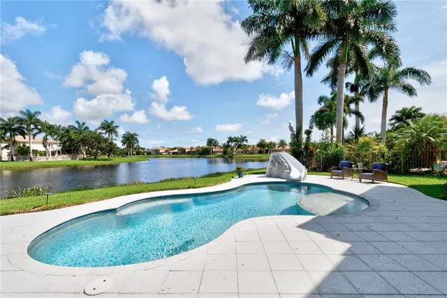 a view of a swimming pool and lake view