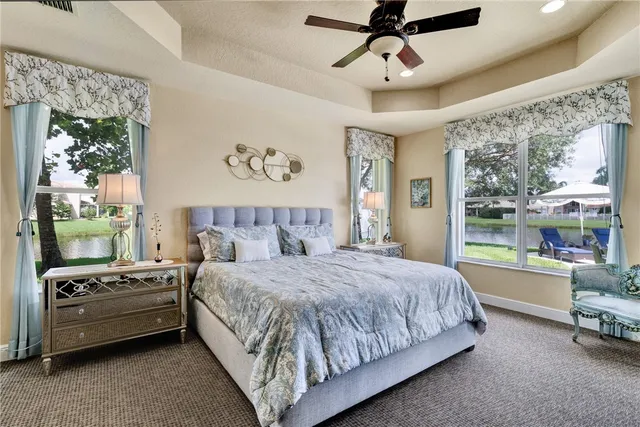 a bedroom with a bed couch and a window