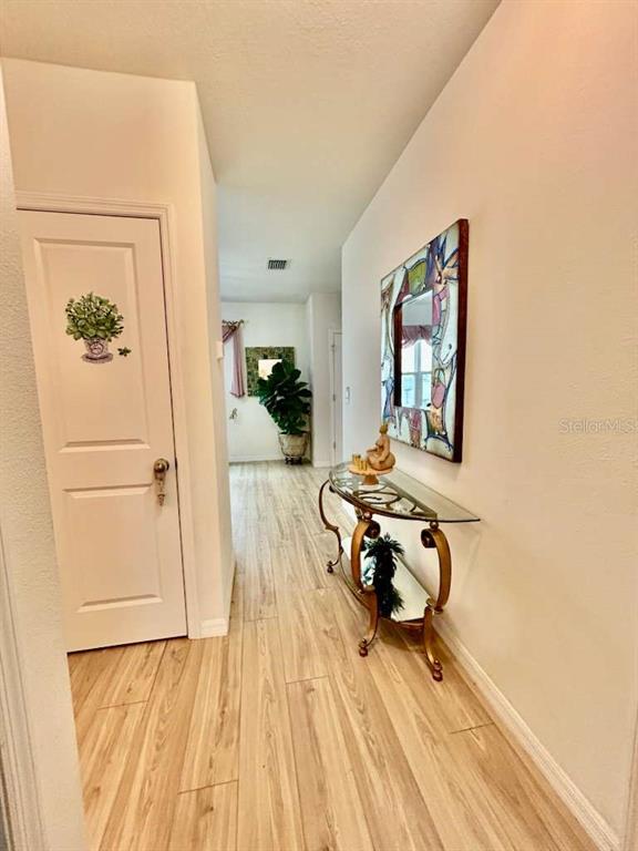 10214 Mangrove Well Road Sun City Center, FL 33573 - Photo 5 of 23 a living room with furniture and a table