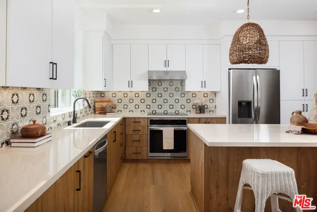 a kitchen with a sink stove and refrigerator