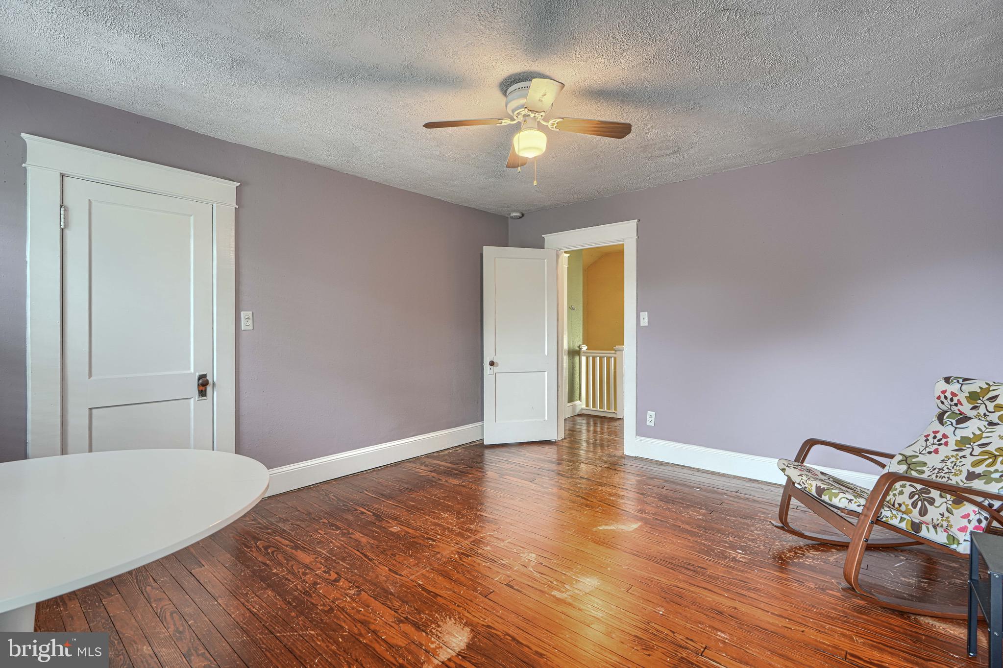 2705 Latona Road Baltimore, MD 21214 - Photo 35 of 53 a view of an empty room with wooden floor