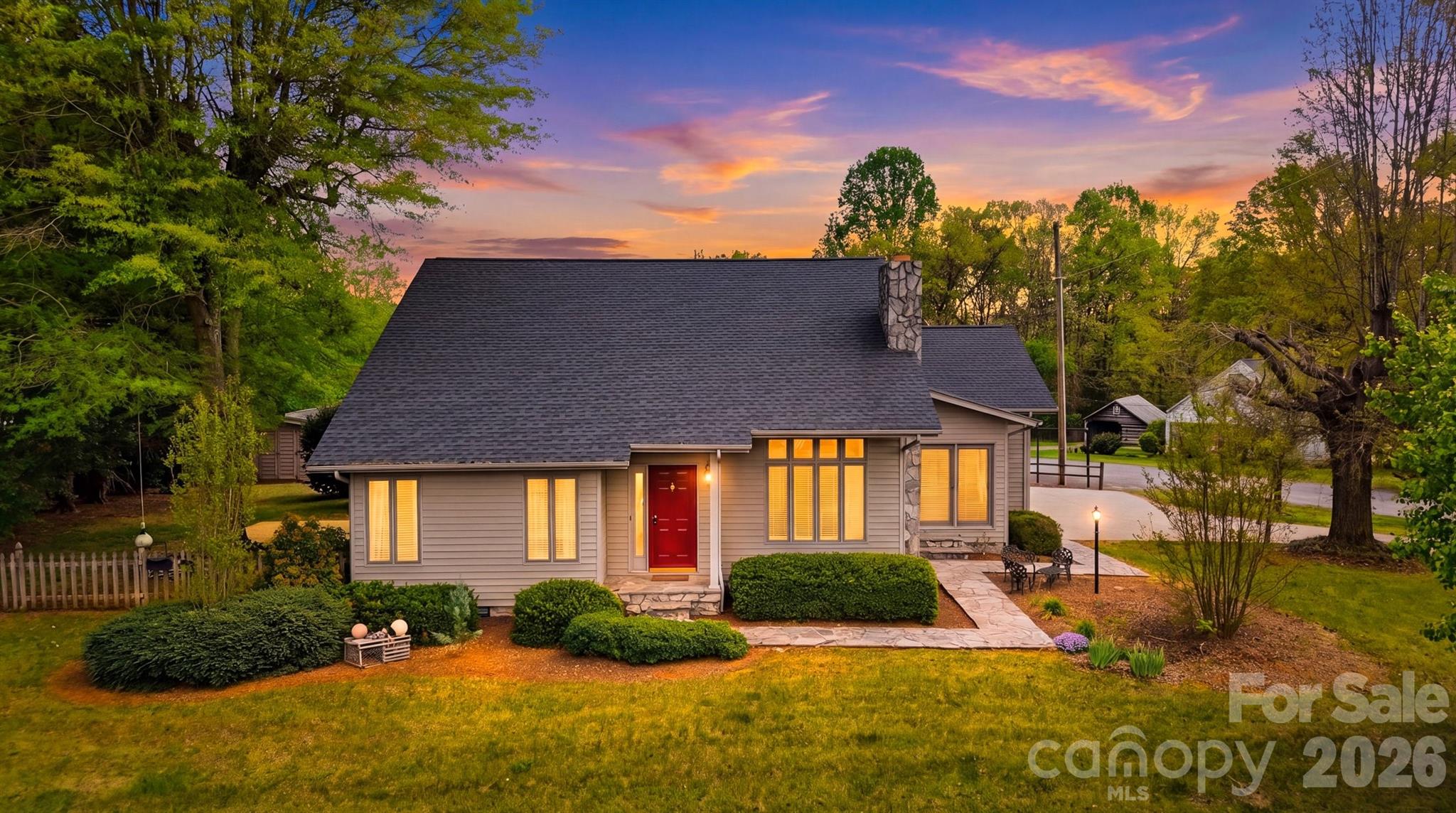 a front view of a house with garden