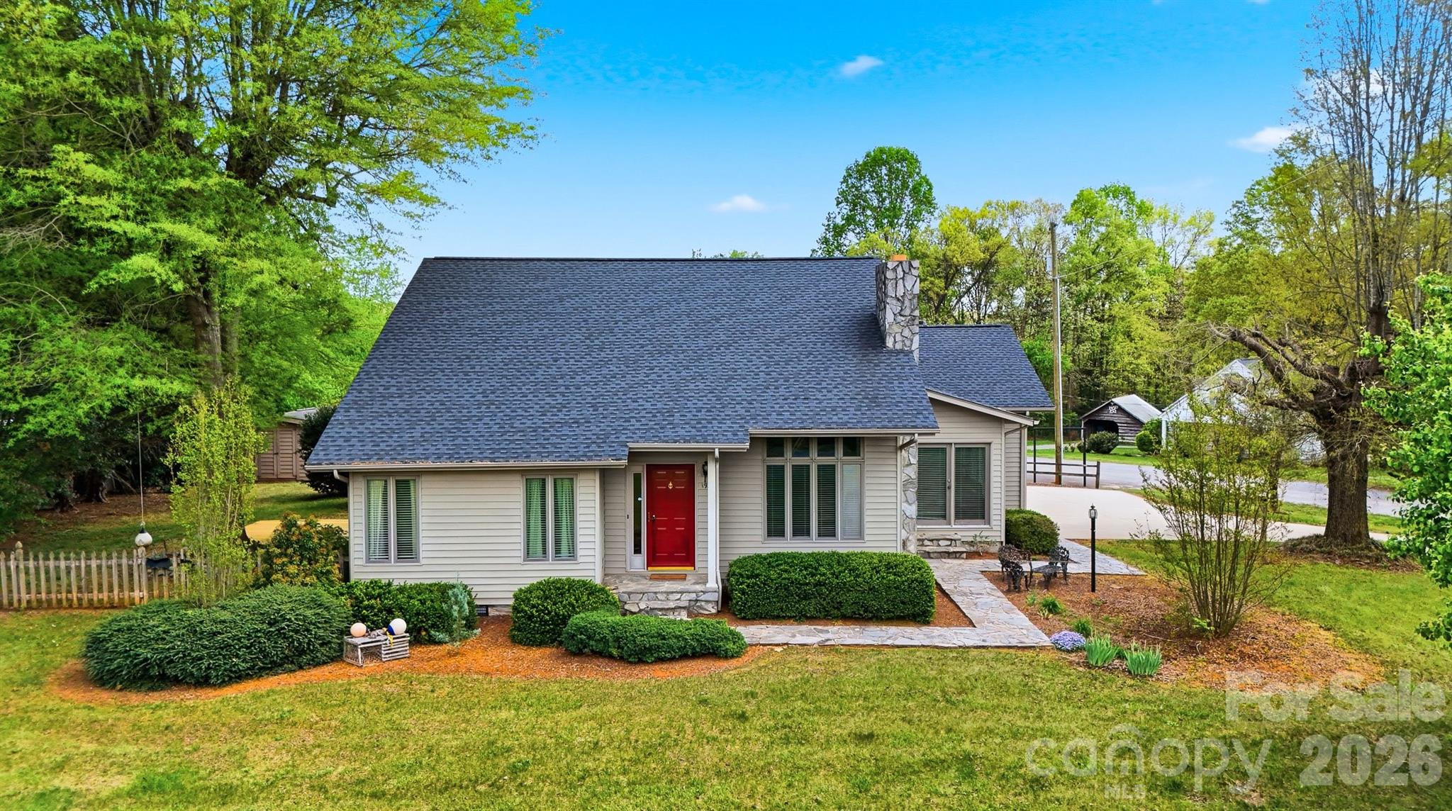 192 Reese Loop Taylorsville, NC 28681 - Photo 2 of 41 a front view of a house with garden