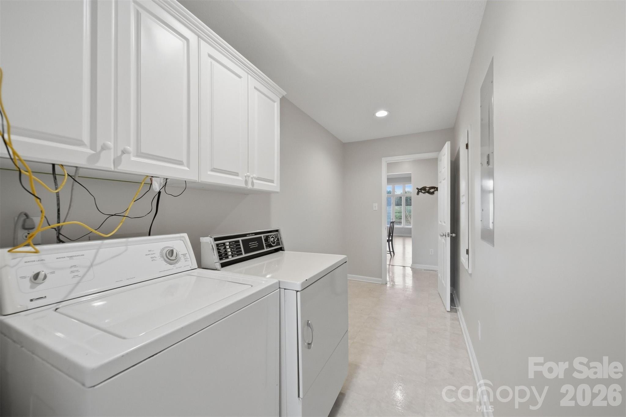 192 Reese Loop Taylorsville, NC 28681 - Photo 27 of 41 a view of storage and utility room with washer and dryer