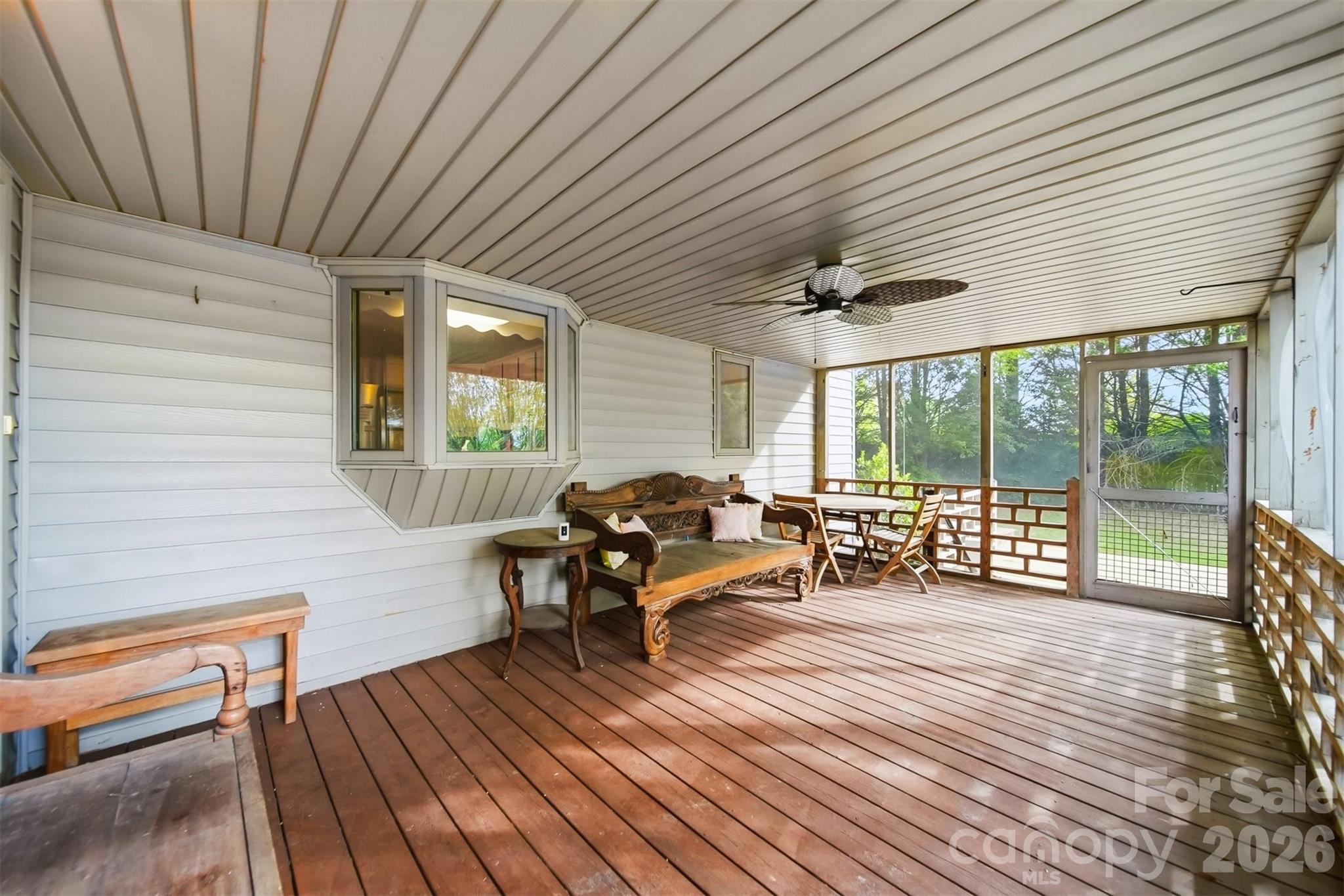 192 Reese Loop Taylorsville, NC 28681 - Photo 29 of 41 a living room with furniture a wooden floor and next to a window