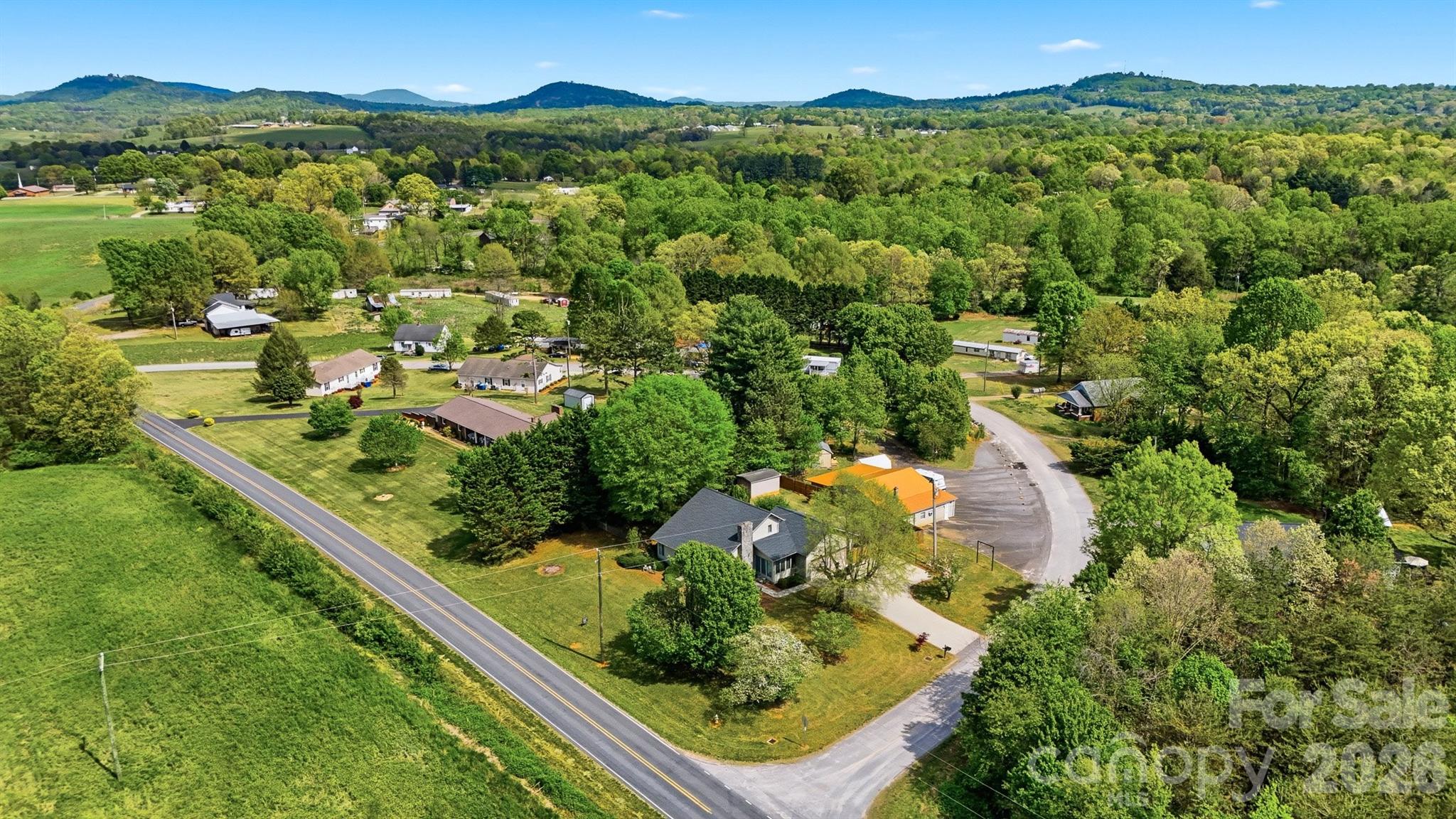 192 Reese Loop Taylorsville, NC 28681 - Photo 40 of 41 an aerial view of residential houses with outdoor space and trees