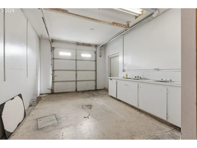 a view of a livingroom with furniture and toys