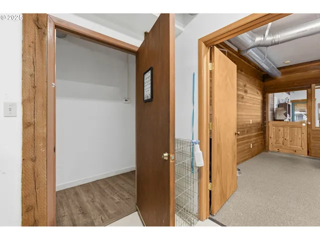 a kitchen with a sink and wooden cabinets