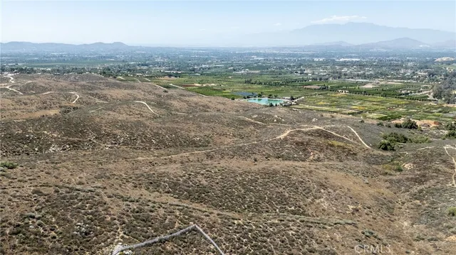 an aerial view of a large building with a city view