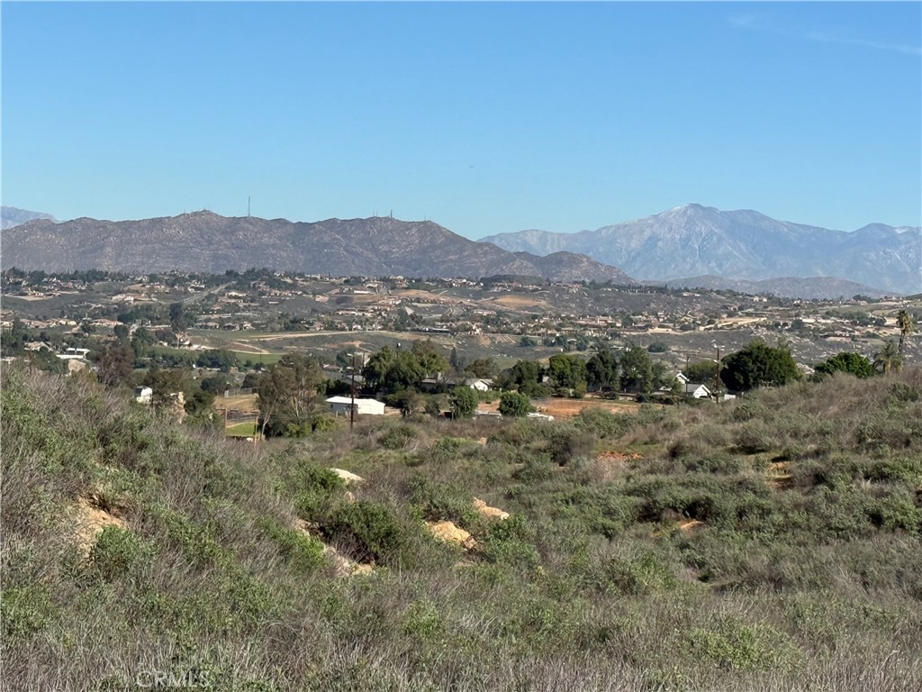 0 Apn, Unit 245080005 Riverside, CA 92506 - Photo 2 of 21 a view of a lush green field with mountains in the background