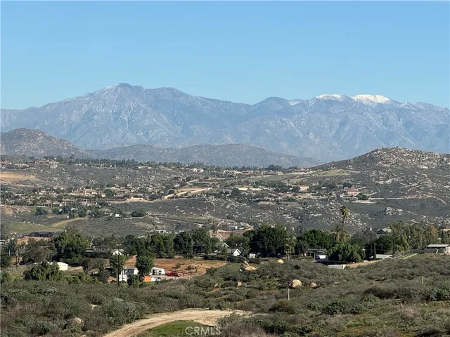 an aerial view of residential house and green space