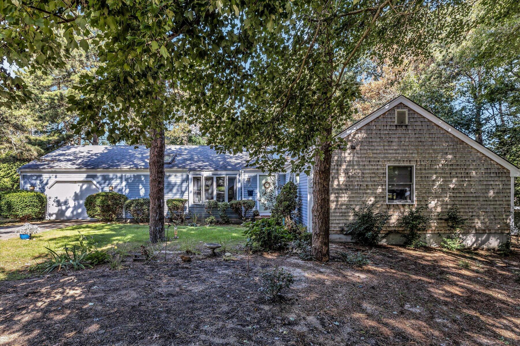 a house view with a backyard space