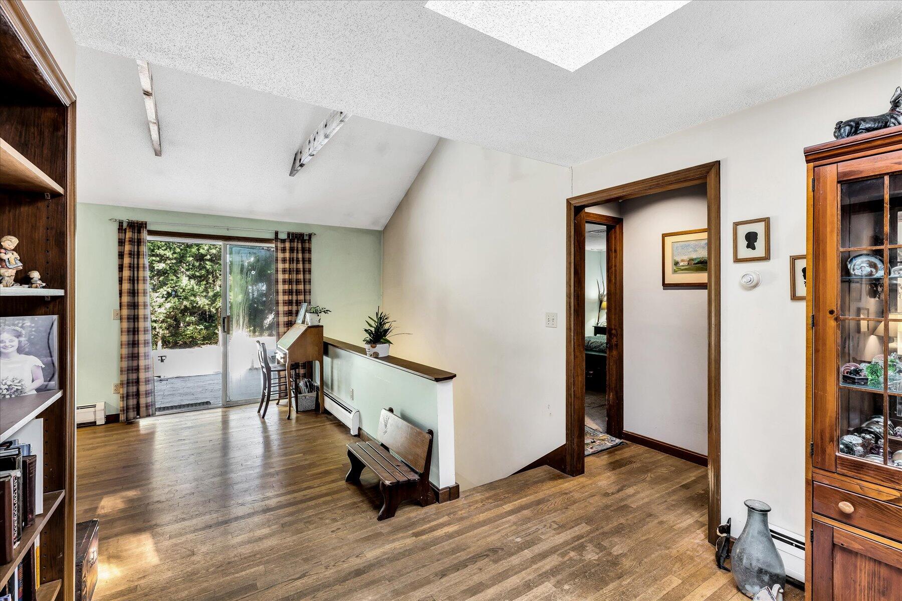 11 Barnacle Lane Mashpee, MA 02649 - Photo 11 of 38 a living room with furniture and a wooden floor