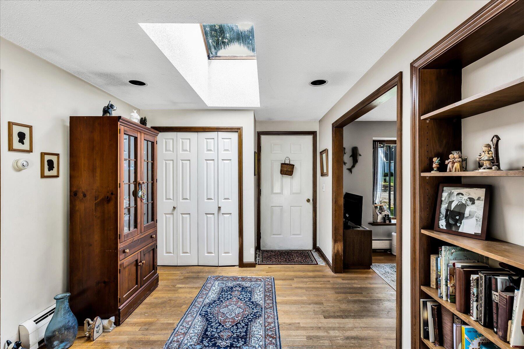11 Barnacle Lane Mashpee, MA 02649 - Photo 12 of 38 a view of a hallway with wooden floor and furniture