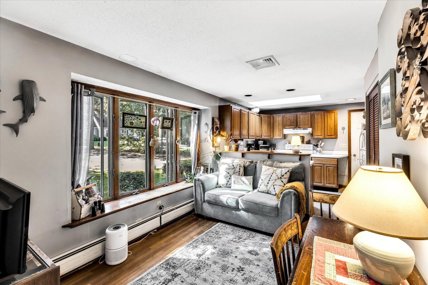 11 Barnacle Lane Mashpee, MA 02649 - Photo 15 of 38 a living room with furniture and a large window