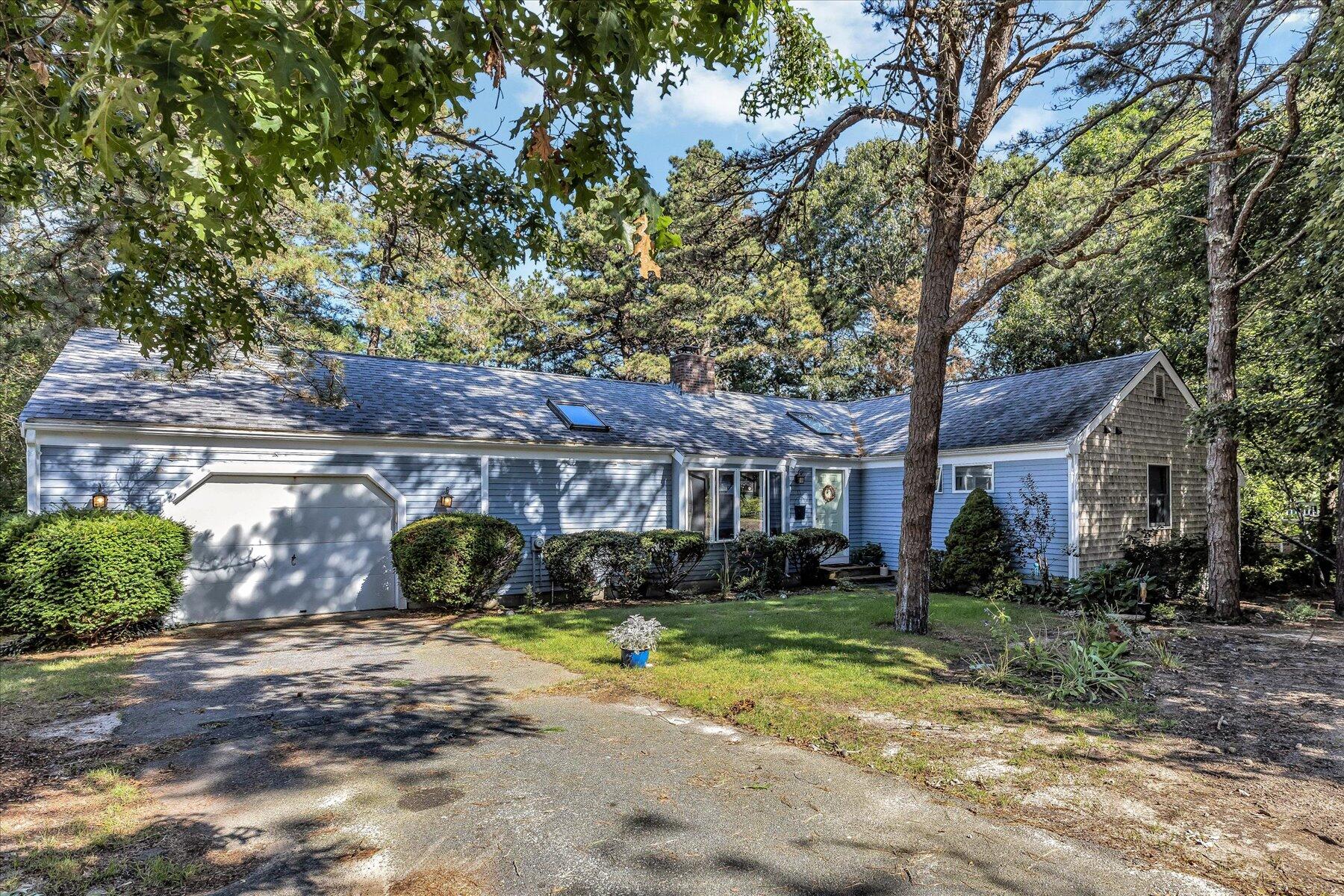11 Barnacle Lane Mashpee, MA 02649 - Photo 2 of 38 a view of a house with a tree in the background