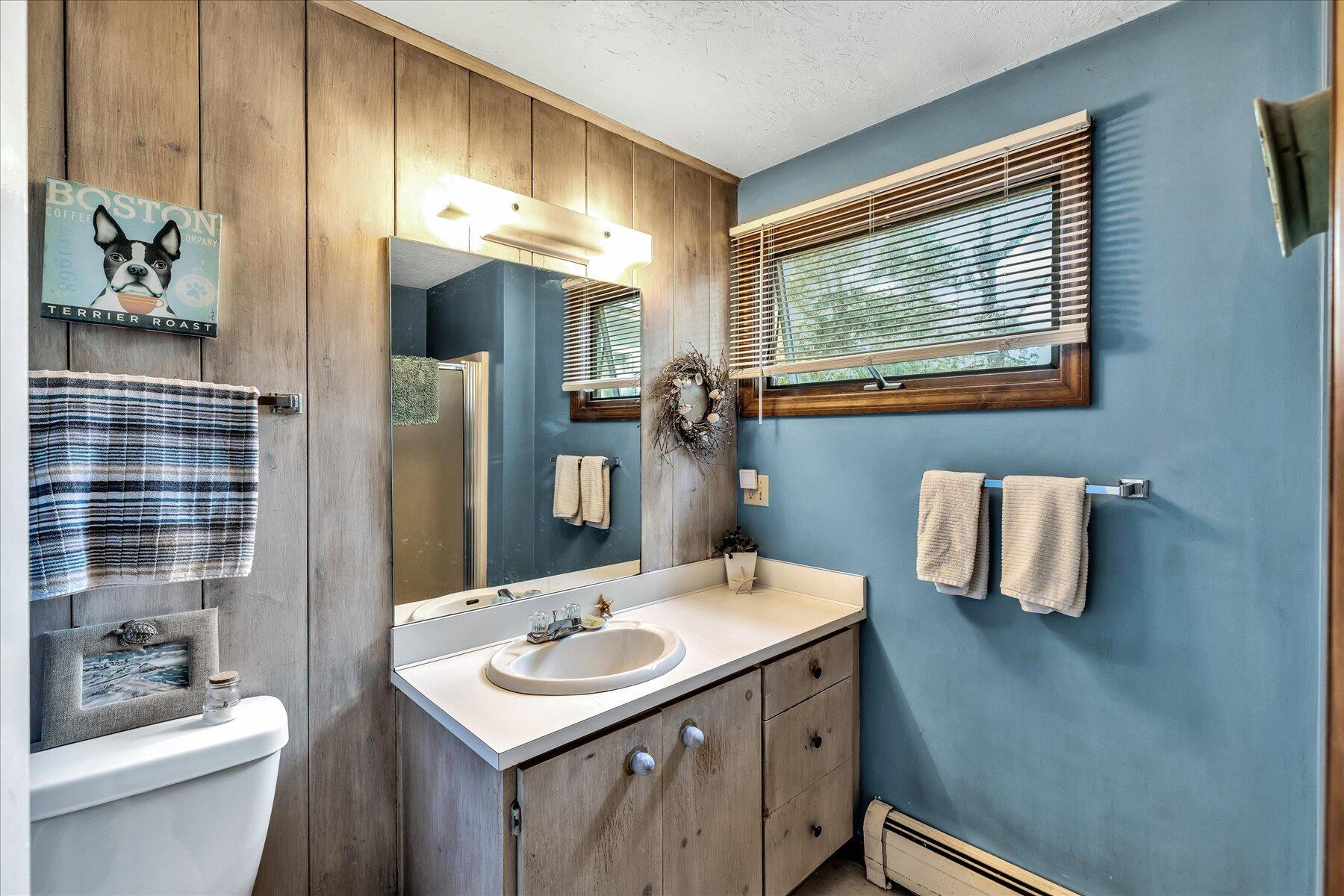 11 Barnacle Lane Mashpee, MA 02649 - Photo 27 of 38 a bathroom with a sink a toilet and shower
