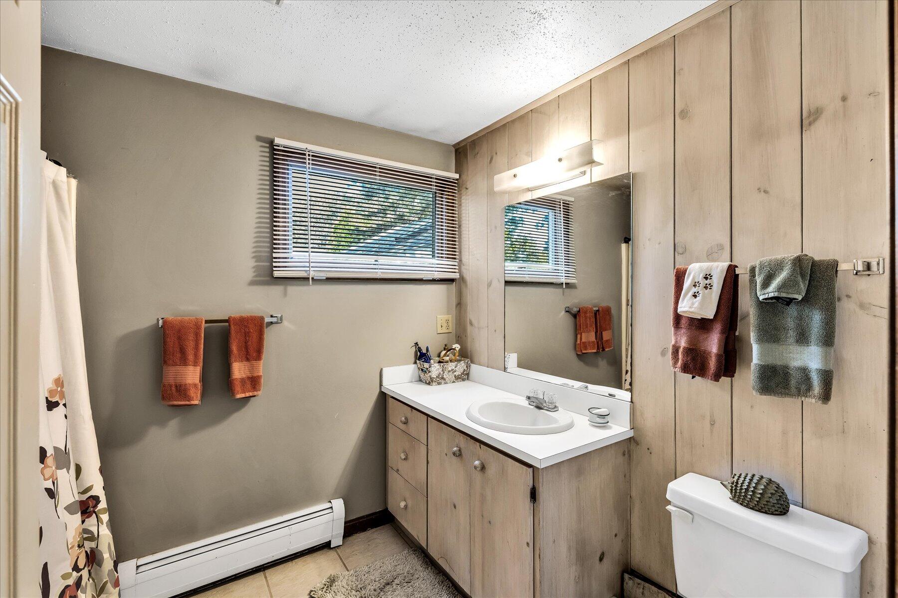 11 Barnacle Lane Mashpee, MA 02649 - Photo 31 of 38 a bathroom with a sink and mirror with toilet