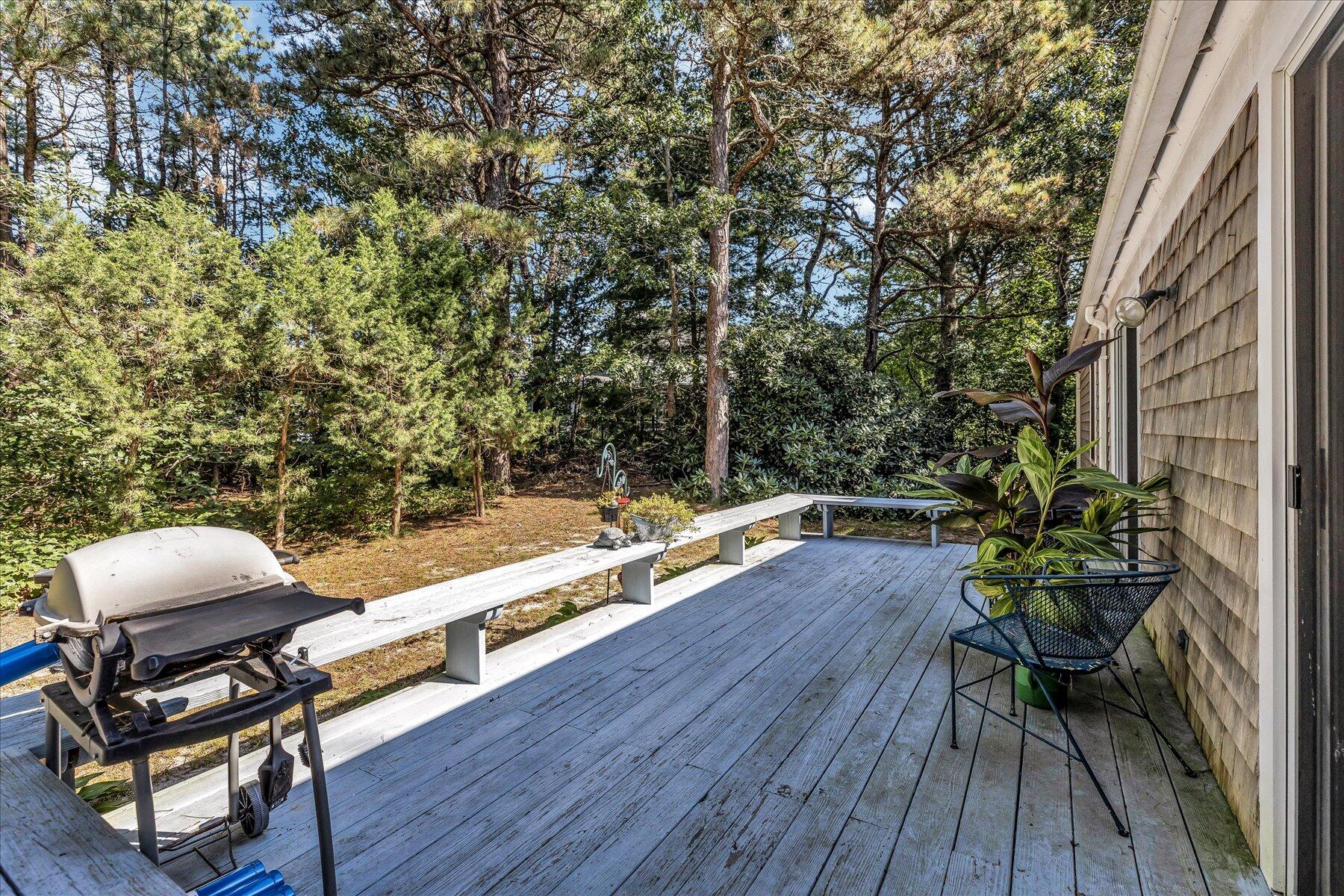 11 Barnacle Lane Mashpee, MA 02649 - Photo 32 of 38 a view of a chairs and table on the wooden floor