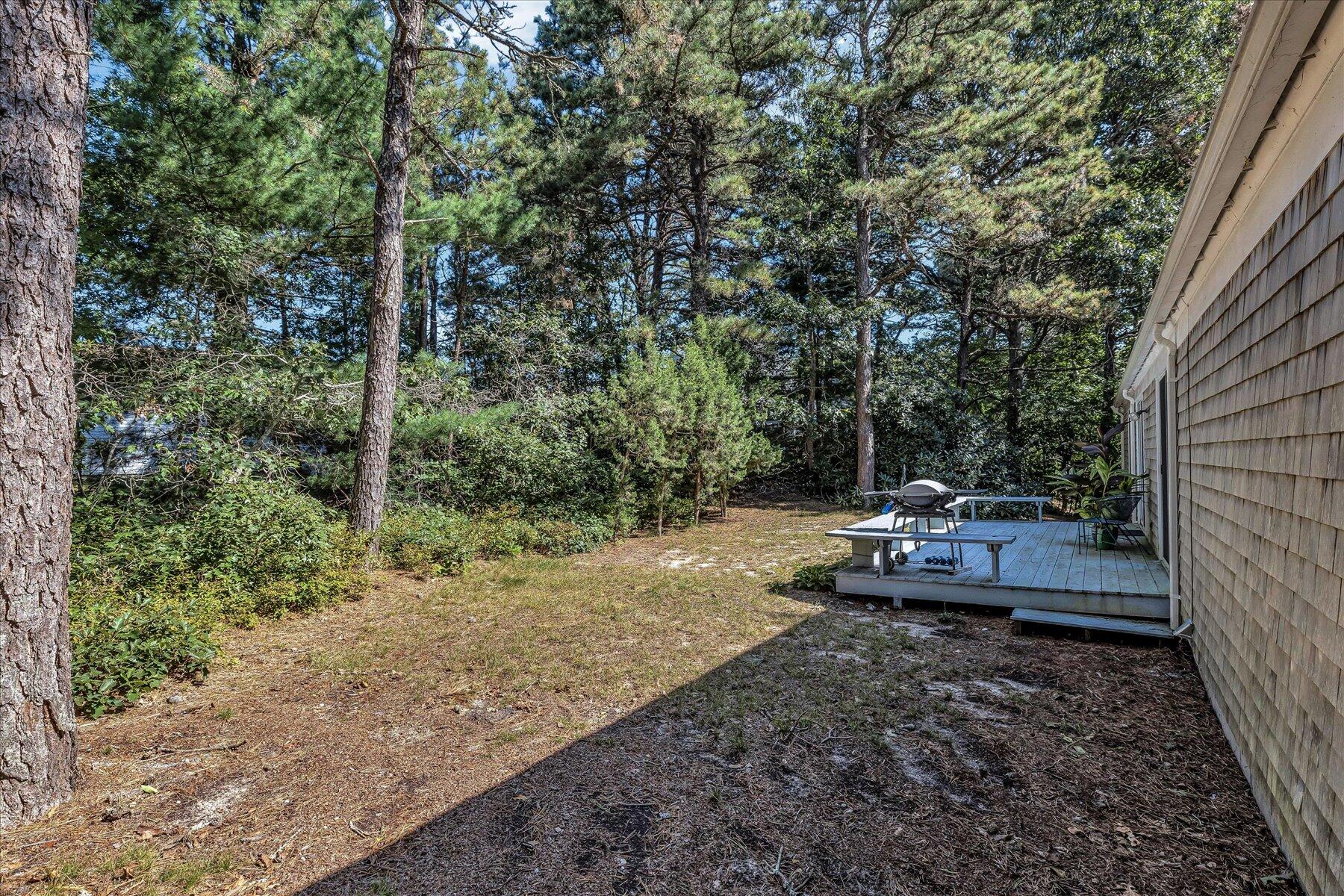 11 Barnacle Lane Mashpee, MA 02649 - Photo 36 of 38 a view of a backyard with sitting area